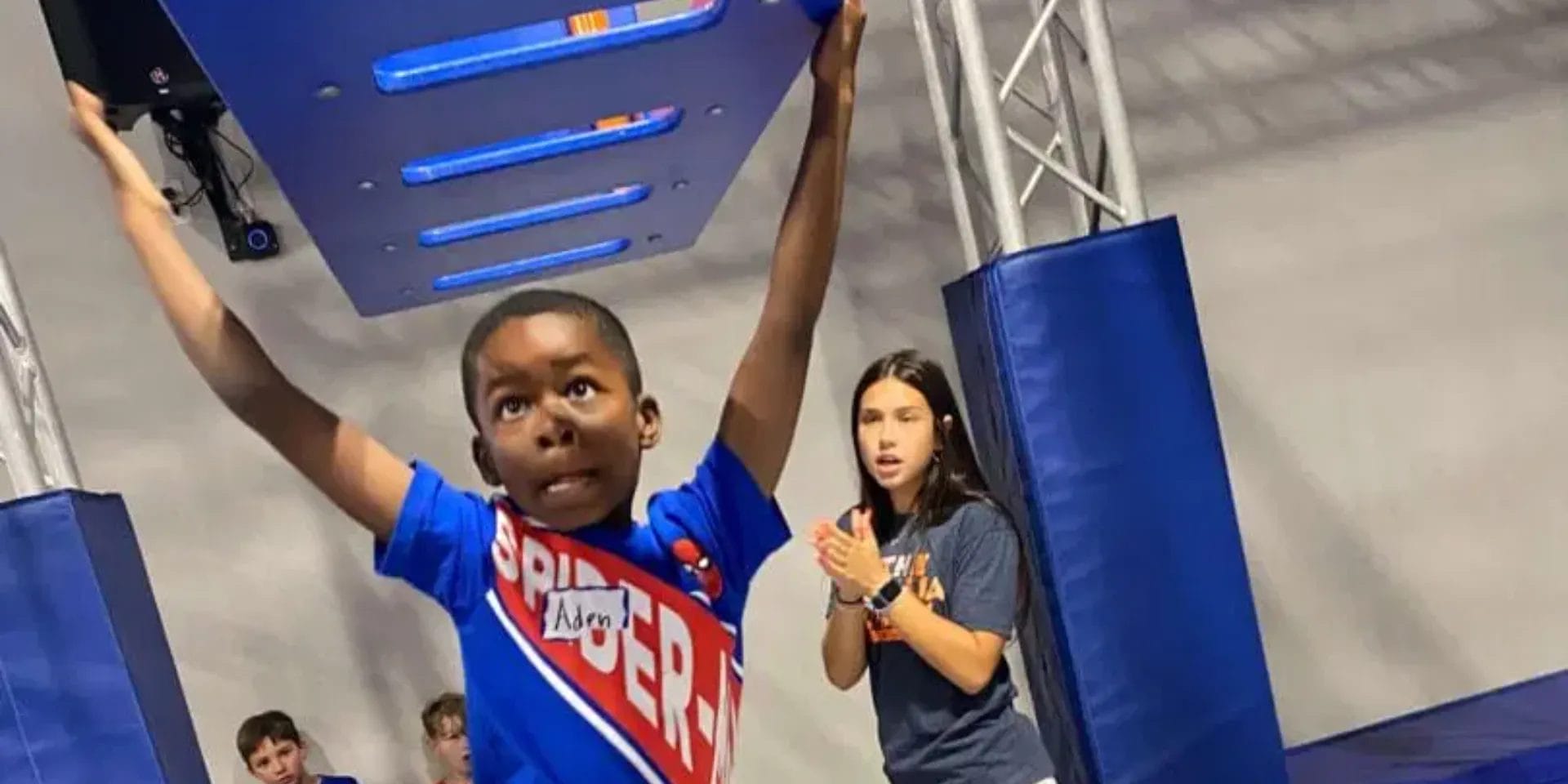 Kid climbing at The Ninja Gym
