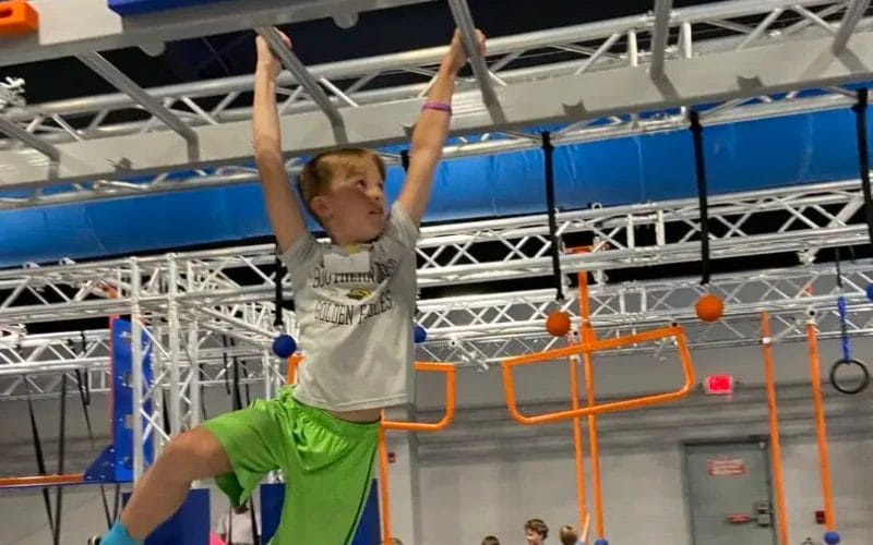 Boy learning skills at The Ninja Gym